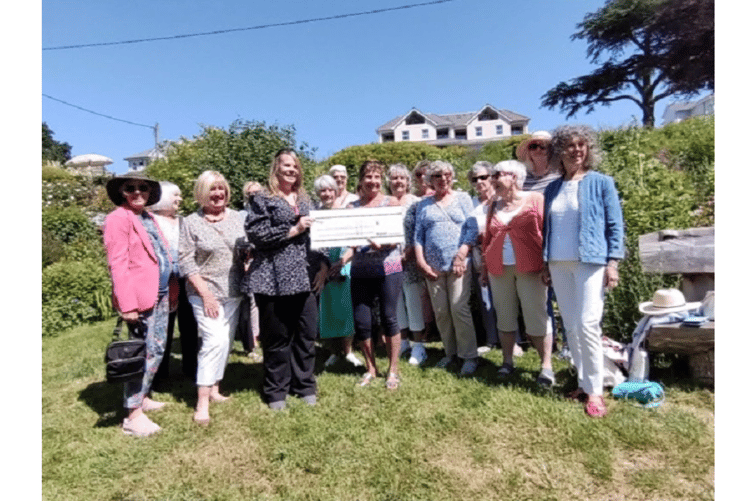 Teignmouth Tangent Club presents a cheque for £3,000 to the Devon Air Ambulance