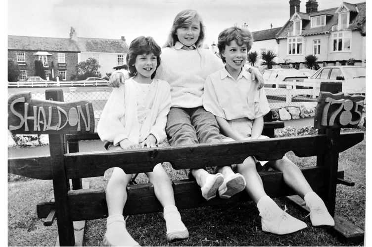 Carnival royalty stuck in the stocks: Zoe Cousins, Kayie Burgess and Rachael Winston
