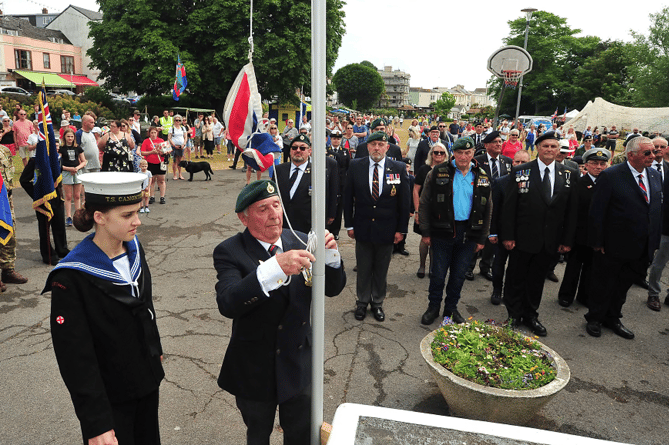 The parade musters on The Lawn at Dawlish and the Union Flag is raised before a short service took place.