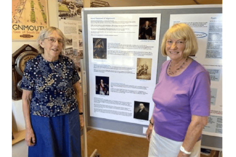 Archivist Jo Hyde and visitor Jenny Ridd, with the display panel about the retired Admiral residents of Teignmouth. Jenny is researching details of Teignmouth seamen who fought Napoleon’s fleet at the Battle of Trafalgar in 1805