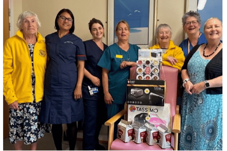 Dawlish's 'Sunflower Bunch' bingo cheque to hospital