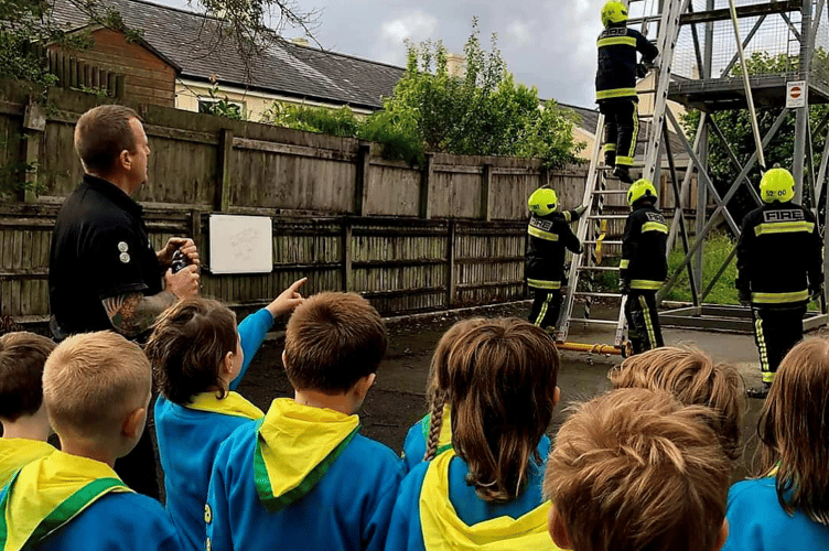 Beavers from 1st Buckfastleigh Scout Group drop in on the town's firefighters