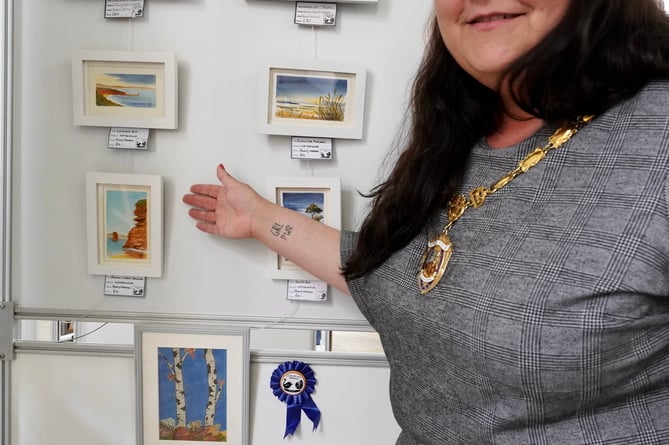                                Mayor of Dawlish Rosie Dawson with some of the work on show at the Strand Centre Dawlish 
