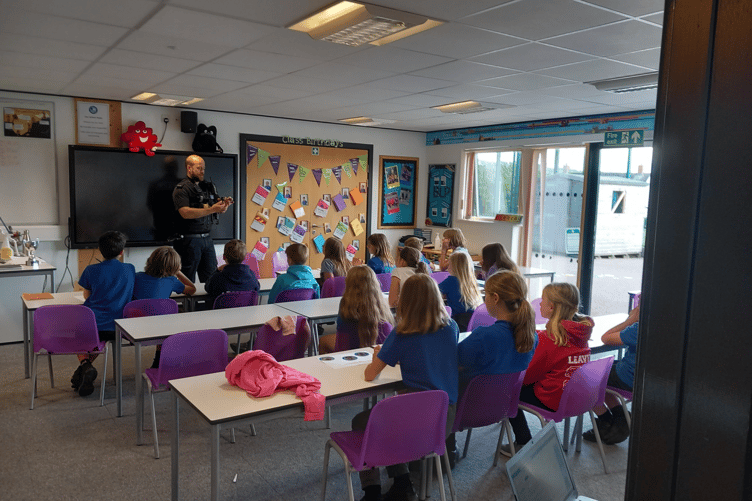 Members of the Neighbourhood Police Team visiting Moretonhampstead Primary school