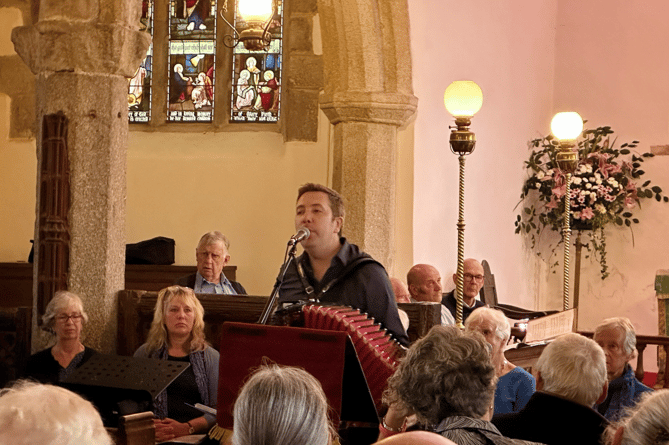 Jim Causley performing at St Pancreas church in Widecombe-in-the-Moor