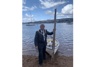 Rowing across the Teign... all in a days work for council Chairman