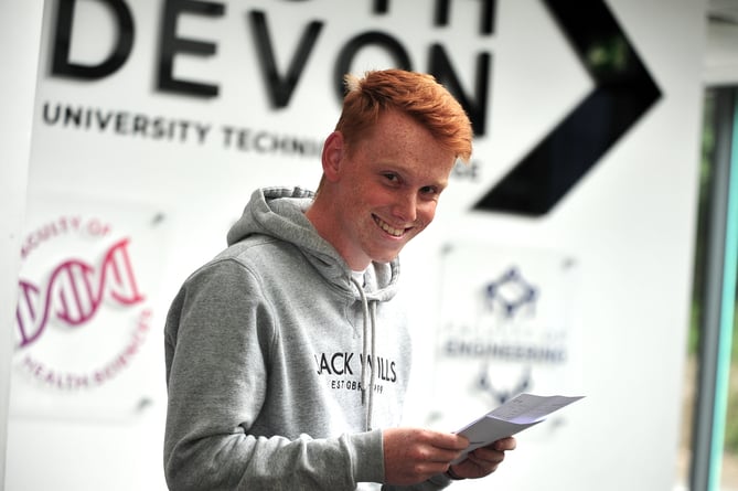 A-Level results at South Devon University Technical College.  James Roberts obviously happy with his triple distinction in Triple Engineering BTEC.  
The Kingsteignton student will be returning to the college at the start of the autumn term. 'I'll be back here at SDUTC in September,' he explained. 'But this time I'll be wearing a staff lanyard and i.d. badge as I'll be working here as teaching assistant specialising in engineeering.'