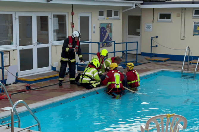 THE crew from Bovey Tracet Fire Station paid their second visit to the town’s outdoor pool last week for some specialist water orientated training. The crew worked alongside staff and lifeguards to rescue an unconscious casualty from open water using water rescue equipment, such as wading suits, flotation devices and throw lines, before performing CPR. A spokesman for Bovey Tracey Fire Station said: ‘We thank the staff at our local pool for allowing us to use their facilities for our drill night on two different occasions and look forward to working with them more in the future.’