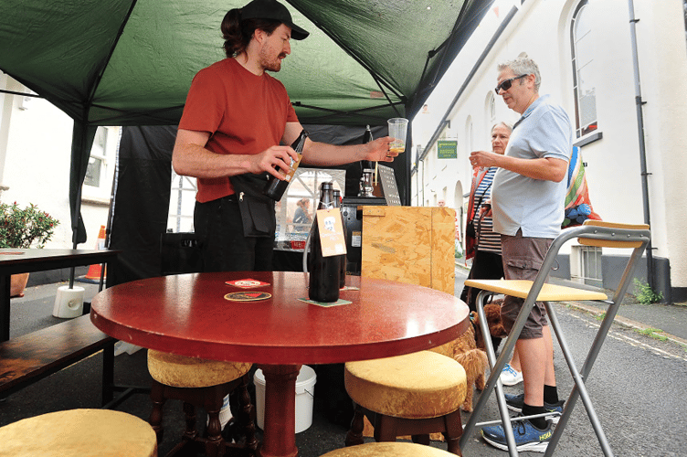 A street bar to desire - Jack Henderson from Newton Abbot’s Copperhead Ales hands out samples to the punters.