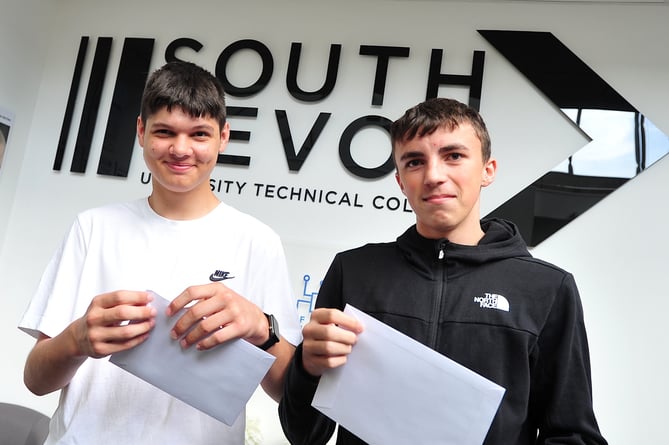 GCSE results day at South Devon University Technical College. Mason Carter and Sam Piper about to open the all-important envelopes. Both students will be returning to the college to continie their enginnering studies.