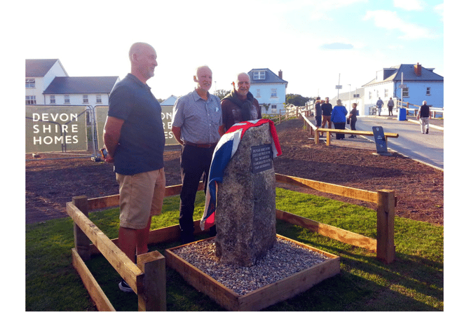 The nephews of Captain Leach unveil the stone.