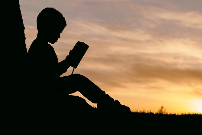 Child reading stock image