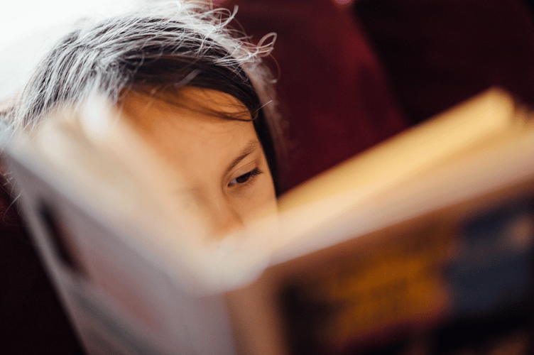 Child reading stock image 