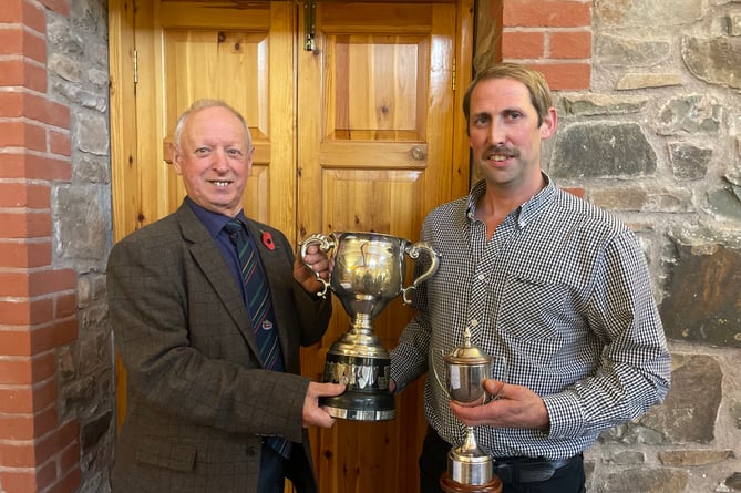 Association president Raymond Govier, left, presenting Donald Tonkin with his Devon Champion trophy.  AQ 9906
