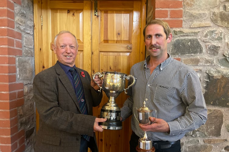 Association president Raymond Govier, left, presenting Donald Tonkin with his Devon Champion trophy.  AQ 9906