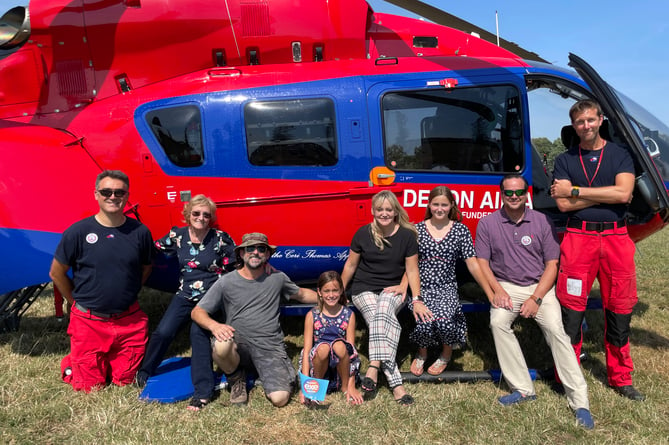 Ann Ralli, second left, with members of her family and some of the DAA paramedics last year.  AQ 3244
