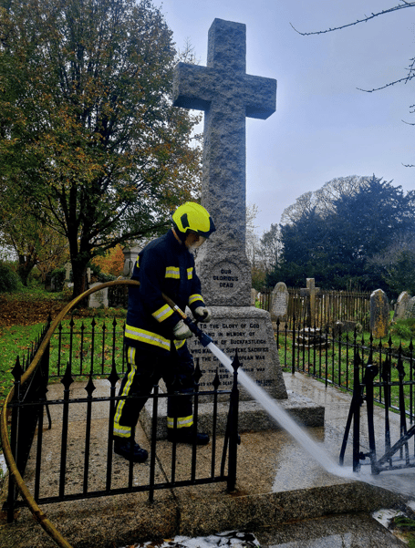 Buckfastleigh firefighters clean war memorial ahead of Remembrance Day