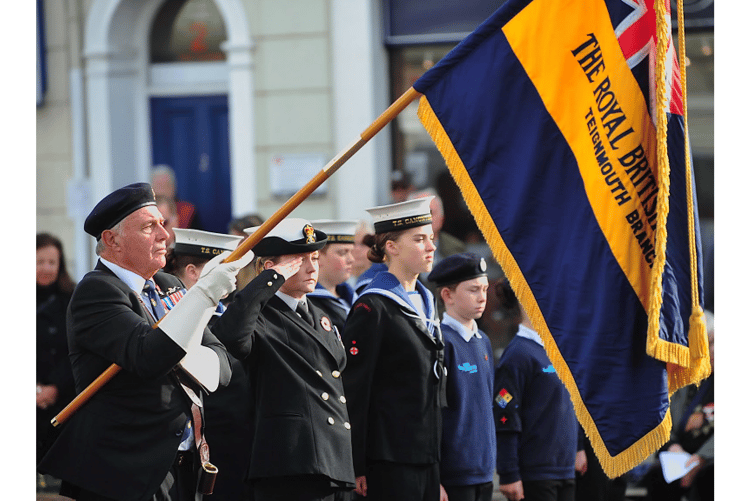 Armistice Day in Teignmouth. At the eleventh hour of the eleventh day of the eleventh month Teignmouth’s RBL standard is lowered as the two minute silence begins.