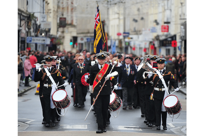 The Devonport Royal Naval Volunteer Band lead Newton Abbot’s parade down Queen Street.