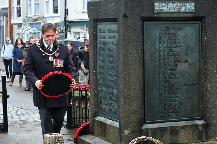 Mayor of Chudleigh Cllr Rick Webb lays a wreath at the town’s war memorial.