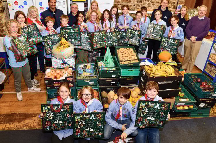 Sea Scouts help pack hampers 
