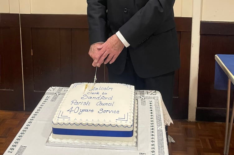Malcolm Vallance cutting the celebration cake. AQ 1044