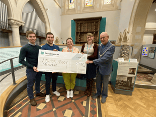 House builder presents Teignbridge museum with cheque worth thousands