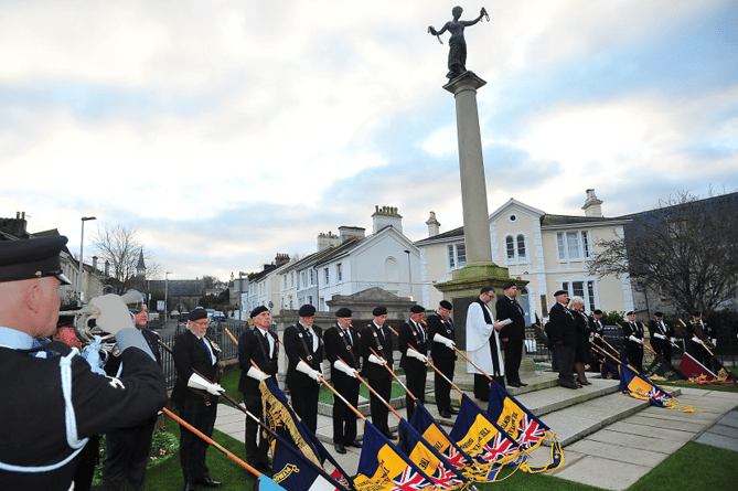 Standards are lowered at the Newton Abbot’s war memorial