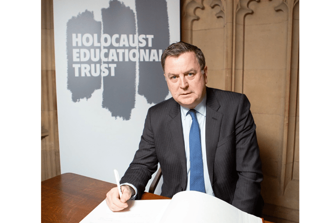 Mel Stride  MP signing the Holocaust Educational Trust’s Book of Commitment in the House of Commons