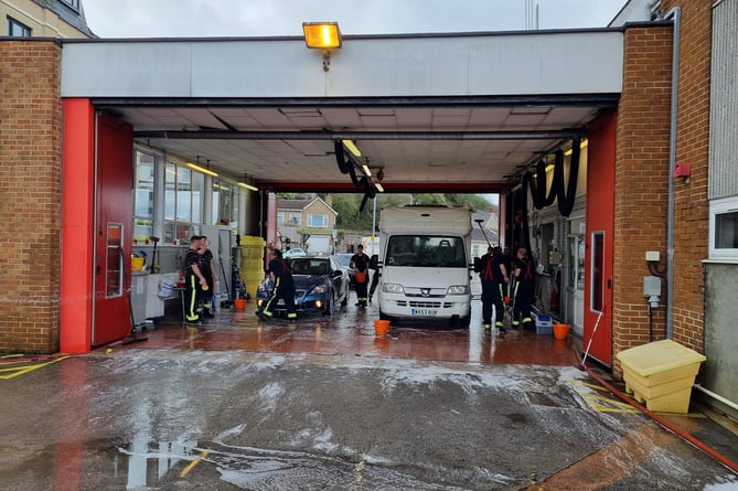 Firefighters from Newton Abbot in action at last year's charity car wash 