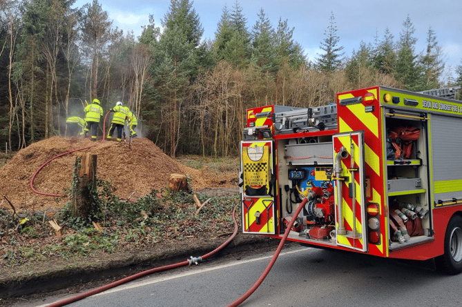 Newton Abbot firefighters tackle smouldering wood chip pile near Stover