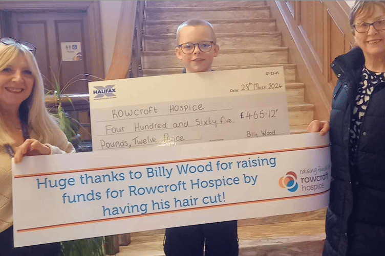 Billy Wood presenting his cheque to Rowcroft Hospice