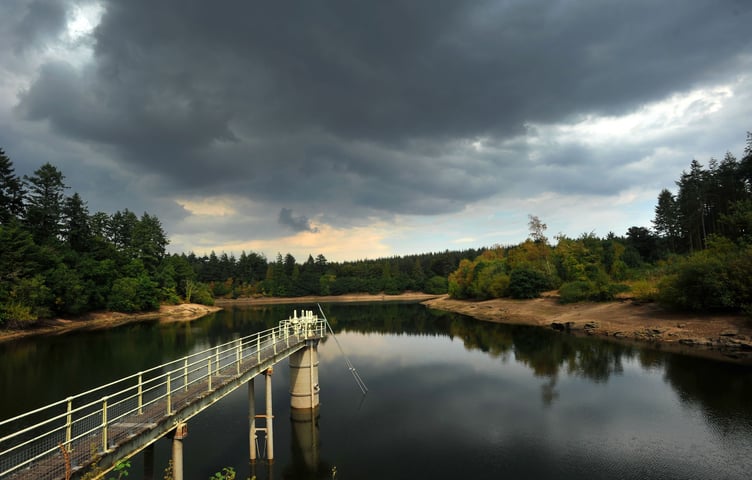 Photo: Steve Pope  MDA150822A_SP002
Summer drought 2022. Storm clouds gather over Tottiford Reservoir in the Teign Vally but it will need many months of rain to replenish the reservoir that is currently at  46% capacity