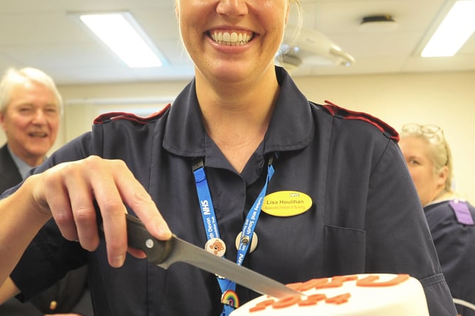 Official re-opening of the MIU at Dawlish Hospital. Lisa Houlihan prepares to cut the cake