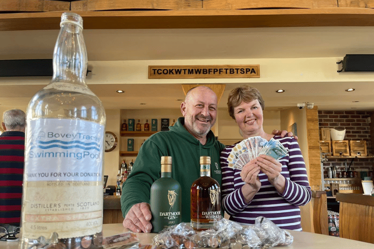 Dartmoor Whiskey Distillery's Greg Millar with Bovey Tracey Swimming Pool's secretary, Vanessa Steer.