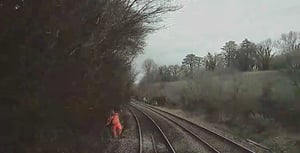 Rail worker in 'near miss' with train