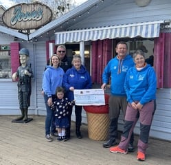 Bovey Tracey's Santa Dash cheque presentation. Left to right: Chris Sims, Rachel Sims, Josie Sims from Josie's and Jolly Roger; Moira Stokes from Heart Heroes;and Ian Hutchings and Sue Hutchings from Bovey Tracey Lifesaving Club