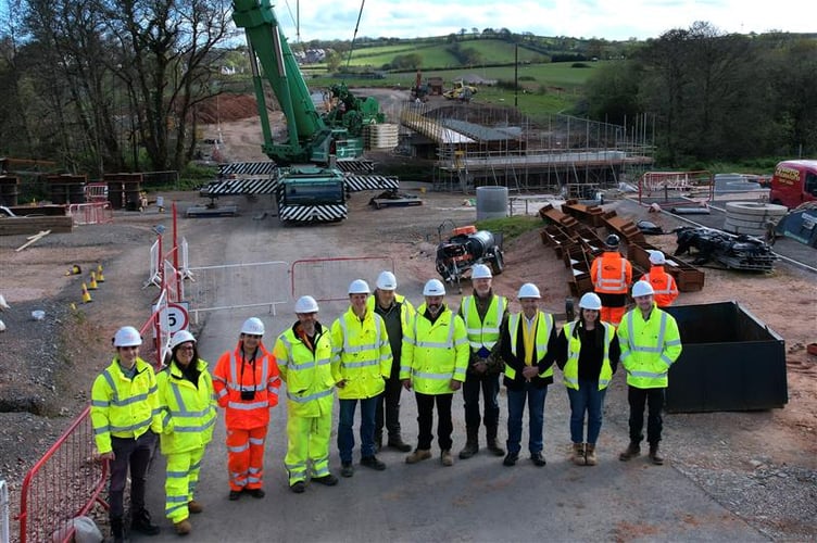 Representatives from organisations involved watch the bridge lift in Dawlish. Photo Montel Civil Engineering 