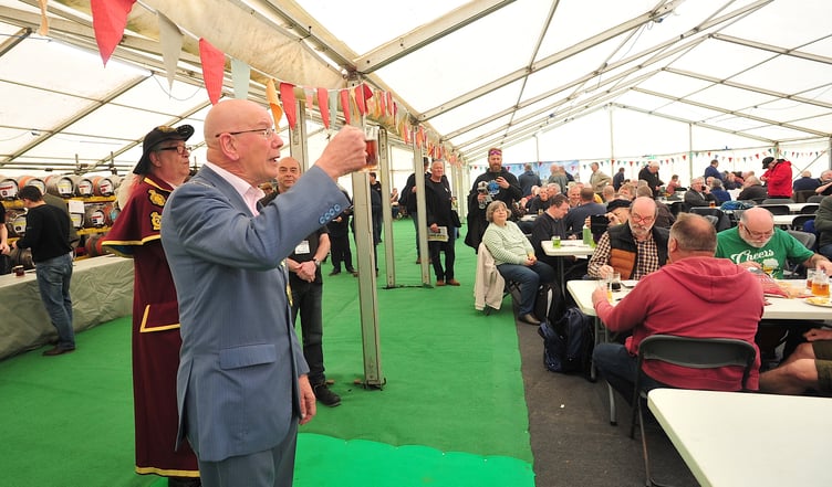 MaltingsFest beer festival at Newton Abbot. Newton Abbot mayor Cllr David Corney-Walker raises a glass to officially open the event.