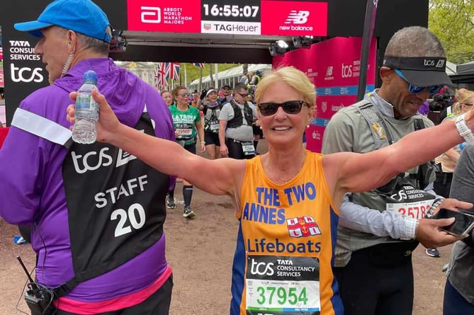 Anne Steele Arnett from Teignmouth RNLI at the finish line of the London Marathon 2024