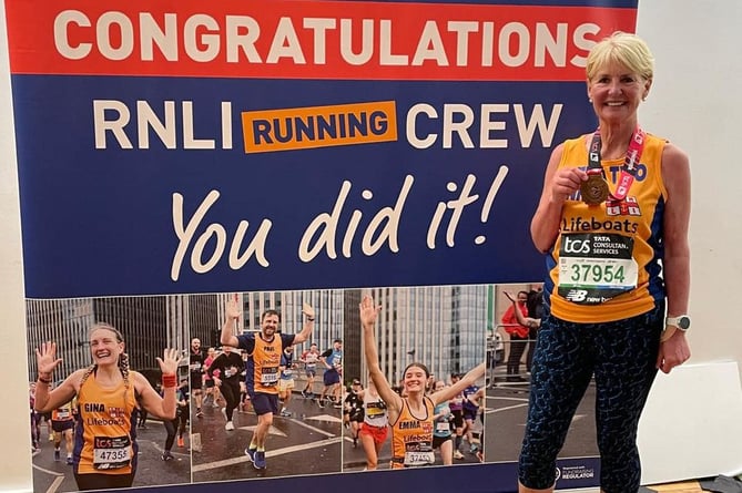 Anne Steele Arnett celebrates after running the London Marathon for the RNLI