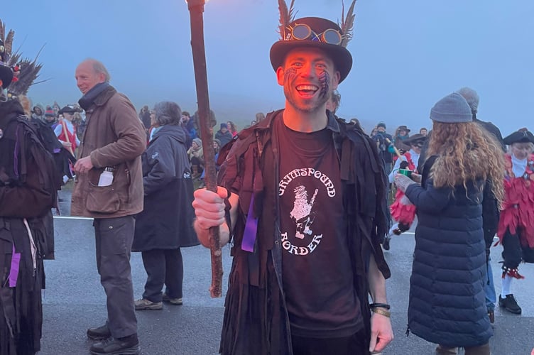 A member of the Grimspound Border Morris awaits the sunrise.