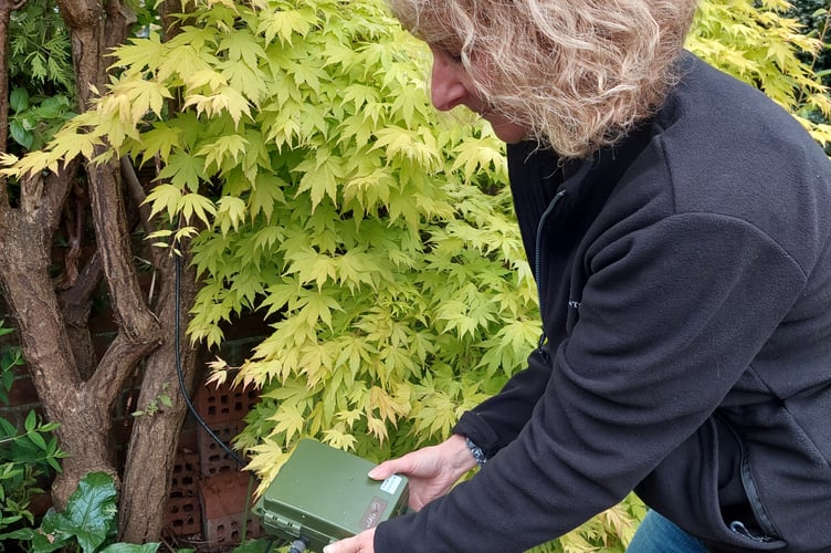 Devon Wildlife Trust Bat Survey Co-ordinator Lindsay Mahon sets up a bat detector