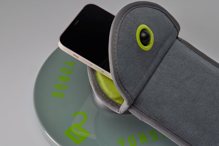 Yondr mobile phone pouch with unlocking station
