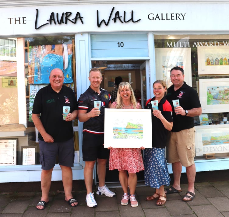 Laura Wall presents the No1 print of Seaside Scrum to Teignmouth Rugby Club to celebrate its 150th anniversary