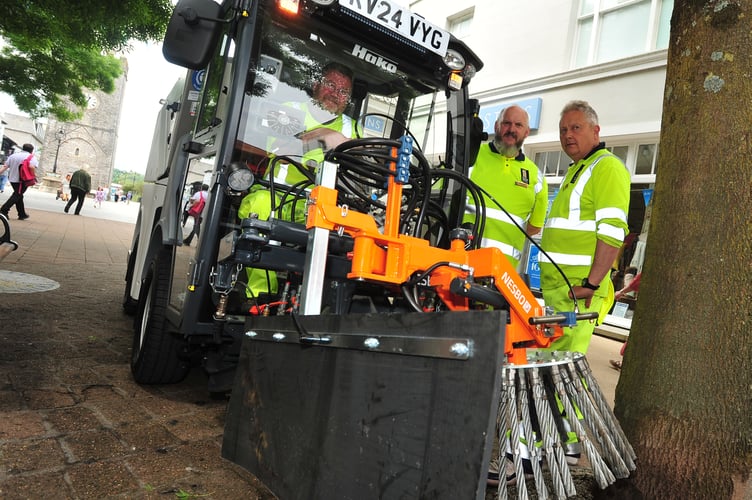 Newton Abbot Town Council town meeting. Meet the lean, mean, multi-cleaning machine. Maintenance officers Dave Samson, Steve Ryan and Tony Little with the council's new street cleaner.