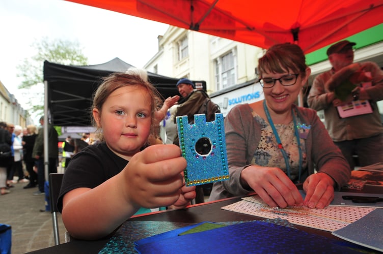 Newton Abbot Town Council town meeting. Five year old Harper Fone from Newton Abbot enoyed making clock tower brooches with Lucy Cokes from Newton Abbot Museum.