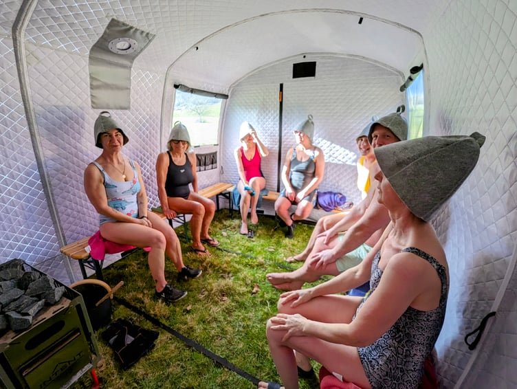 Socialising in Devon's only pop up wild sauna tent