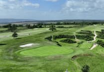 Lin lifts Margaret Hutchings Salver aloft at Teignmouth Golf Club