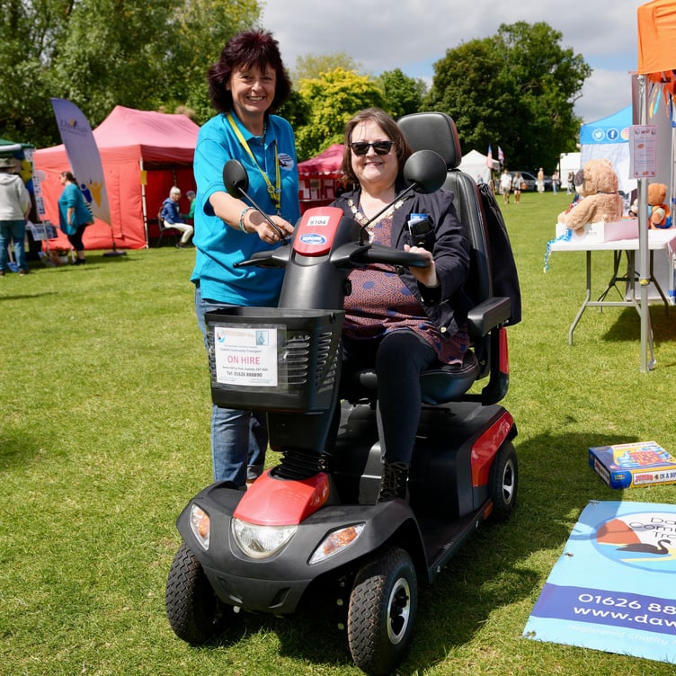 Dawlish Community Transport office manager Sally Preston (left) shows Mayor of Dawlish Cllr Lin Goodman-Bradbury a new mobility scooter